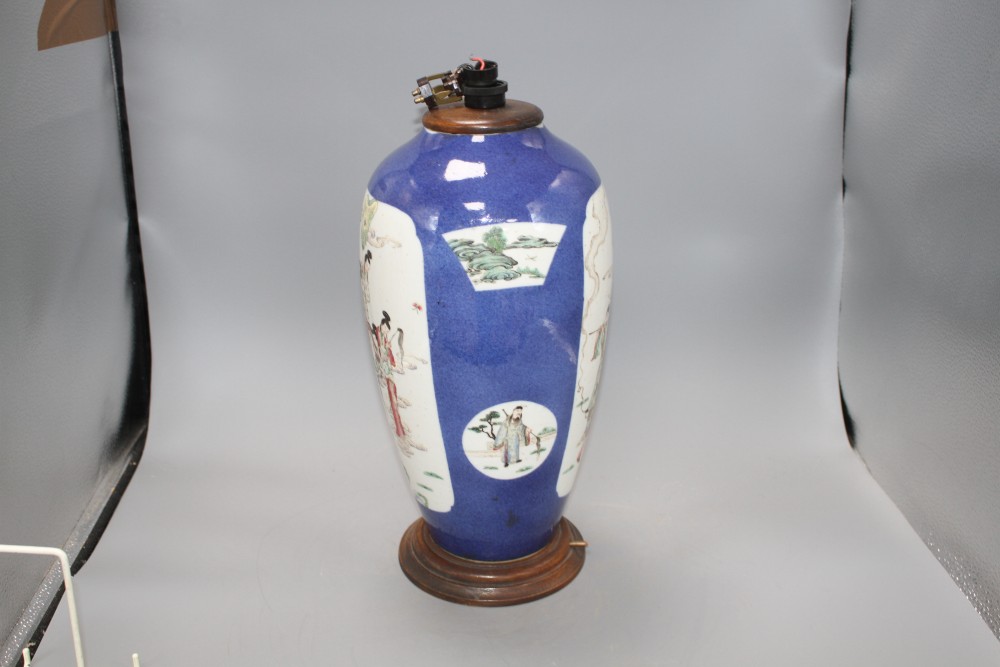 A 19th century Chinese famille rose baluster vase, now cut down and mounted as a table lamp, decorated with panels of immortals